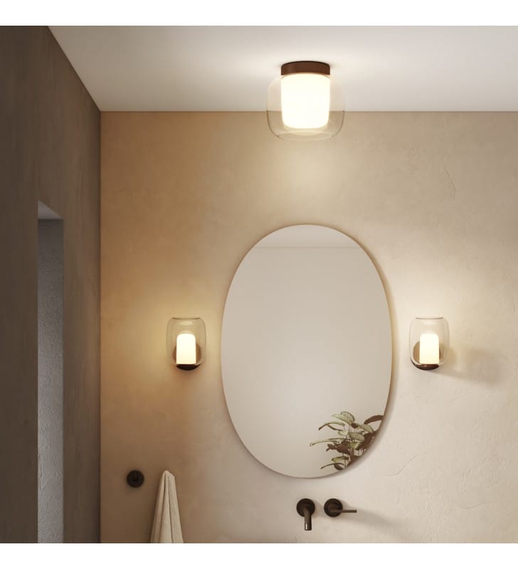 Czarna matowa ścienna lampa do oświetlenia lustra w łazience Aquina montaż klosz w górę lub w dół bezbarwny klosz